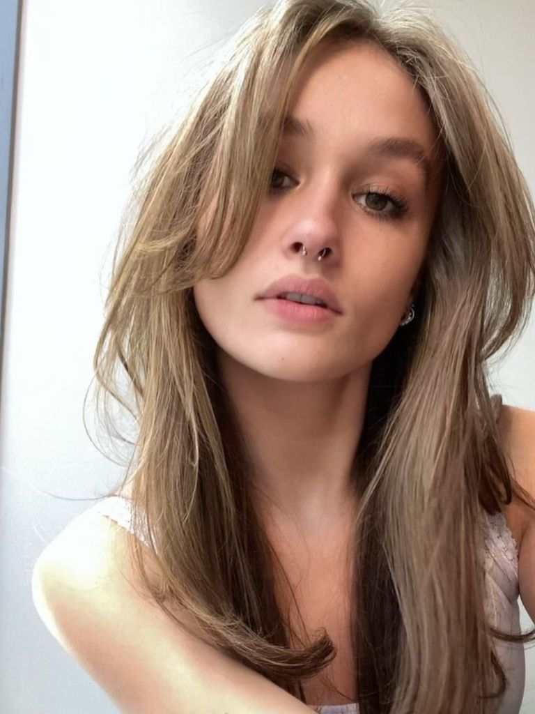 woman with long hair and long curtain bangs