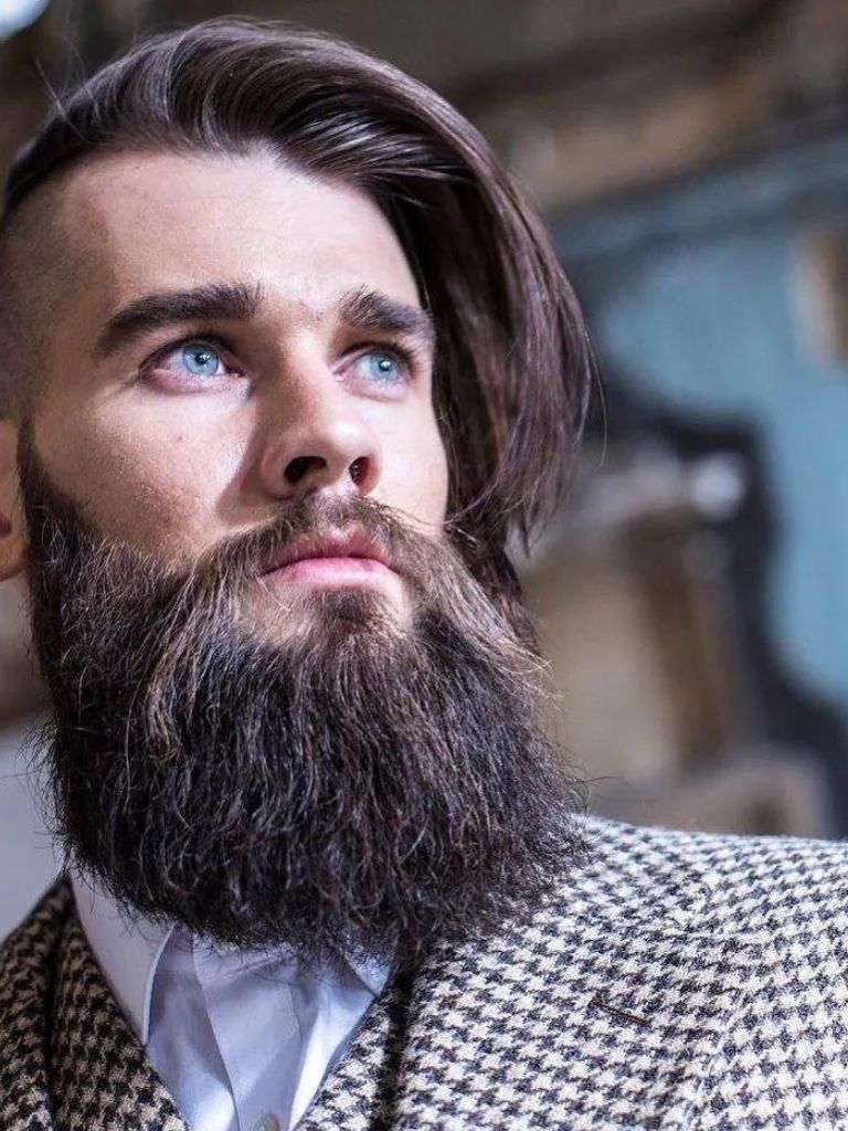 Man with beard and side-swept long undercut hairstyle
