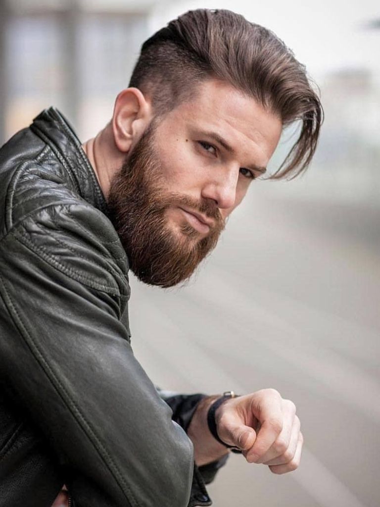 Man with long slicked back undercut hairstyle with beard
