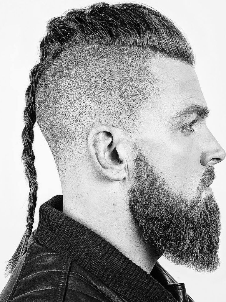 Man with viking braid and bald undercut with beard