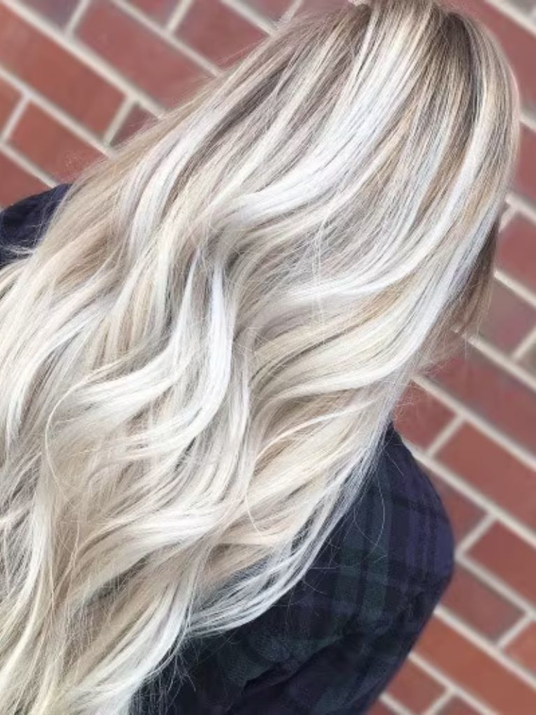Back view of a woman with long white blonde ombre hair