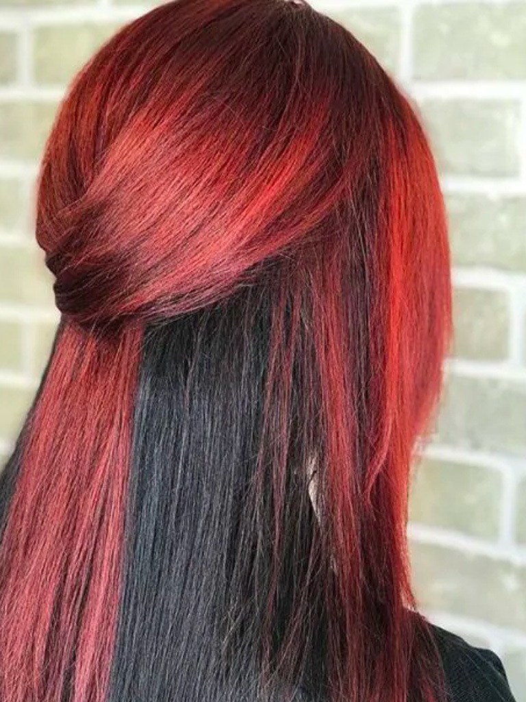 back view of woman with half red and half black straight hair