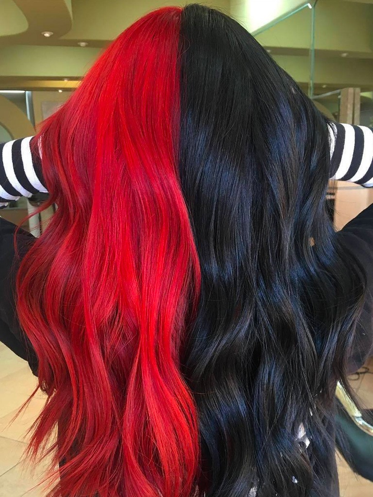Woman with long black and red split dyed hair