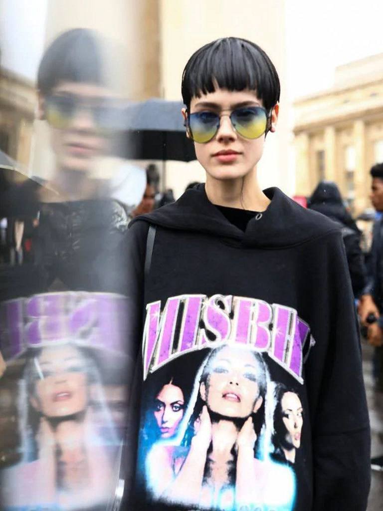 Girl with straight black hair in a precise and beautiful Mushroom haircut