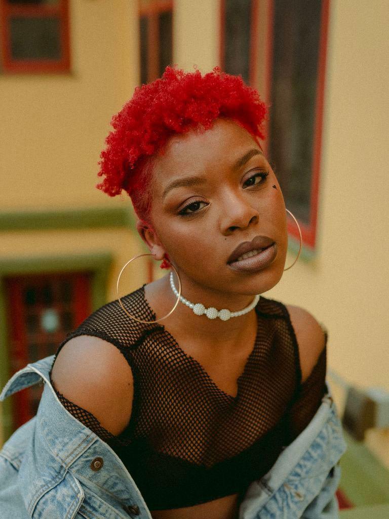 Woman with short cut mushroom hairstyle on natural curl hair