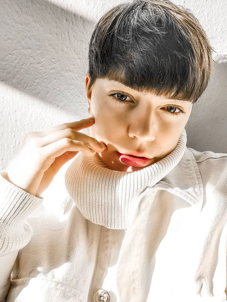 Beautiful bowl cut on woman, that skims the eyebrows