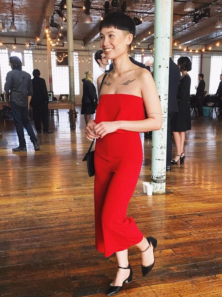 Woman with very short mushroom cut and shaved sides