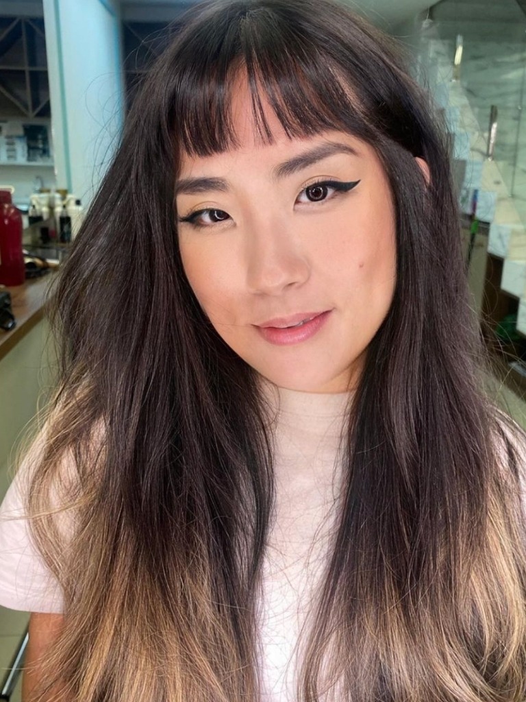 Woman wearing short baby bardot bangs
