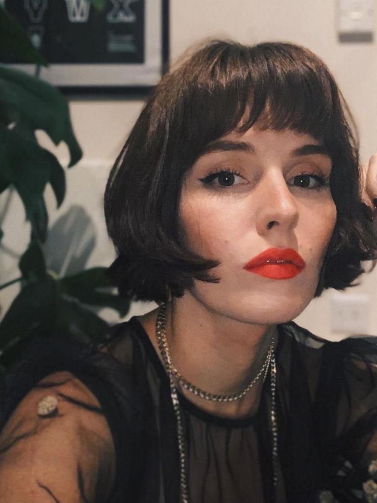 Woman with brown Parisian bangs