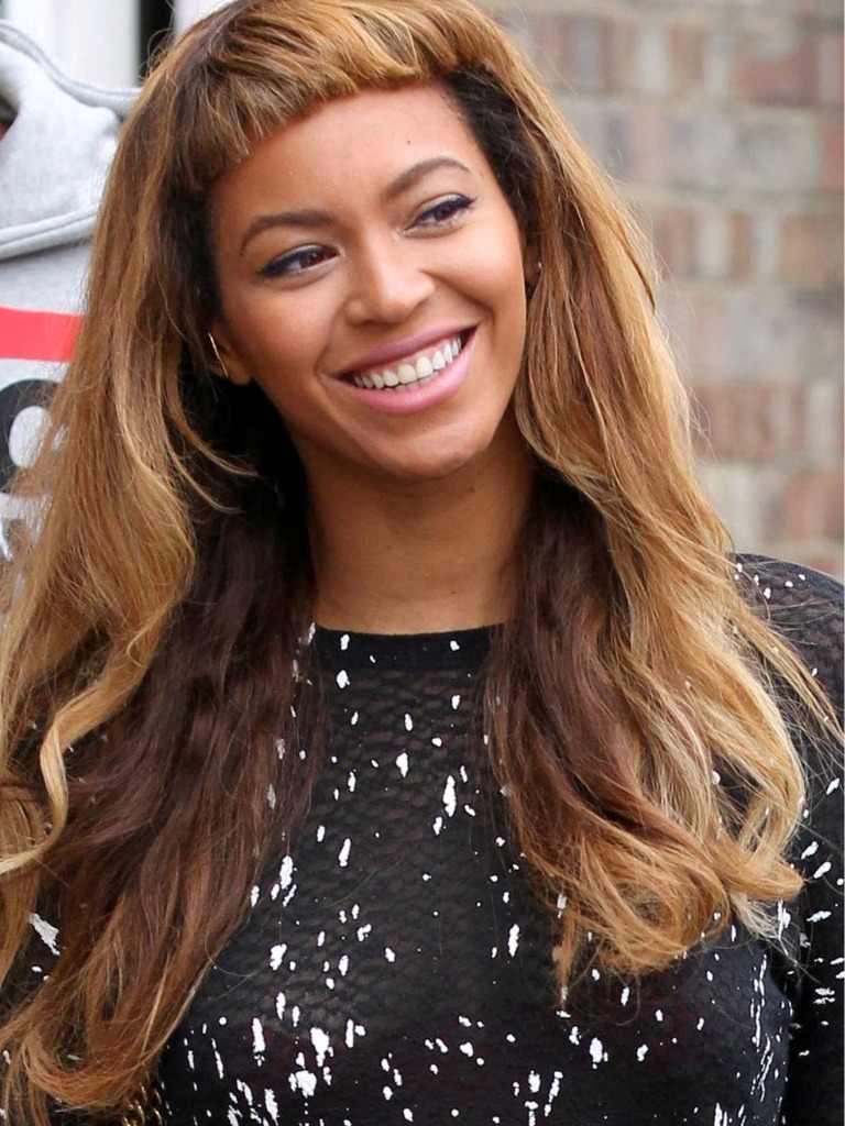Beyonce with short bangs and long brown hair