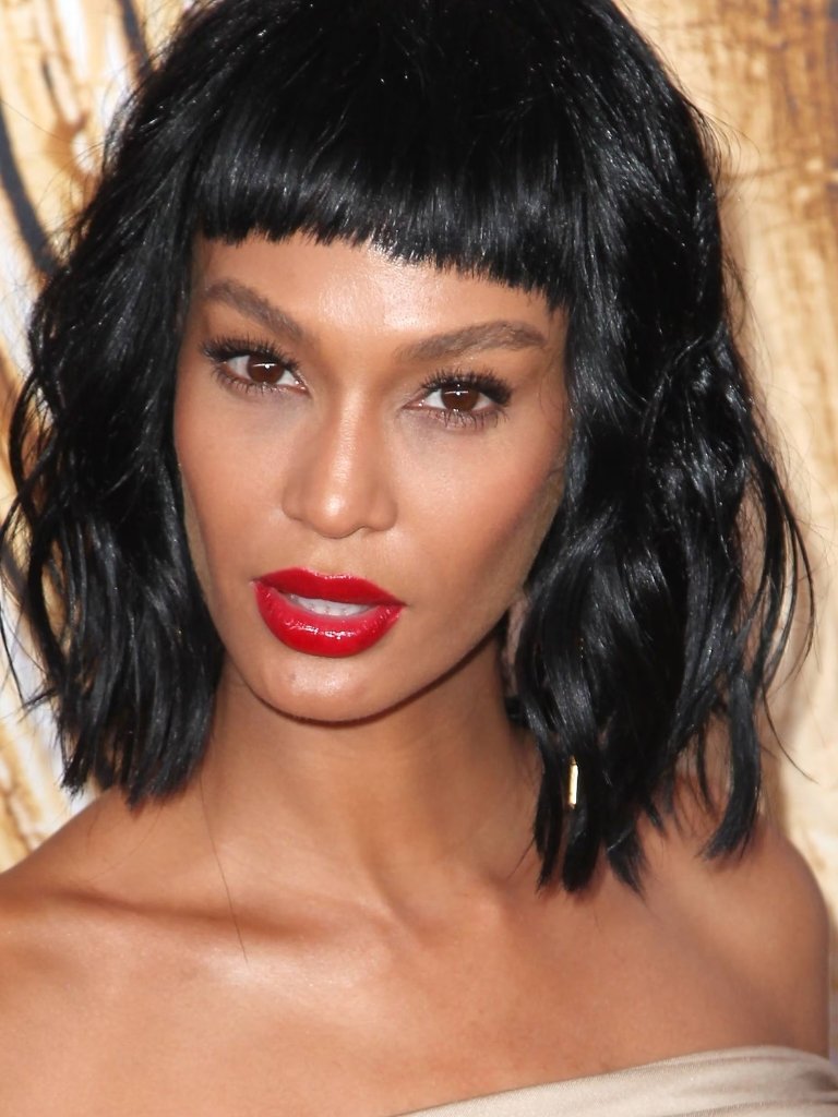 Joan smalls with blunt short bangs and wavy long bob