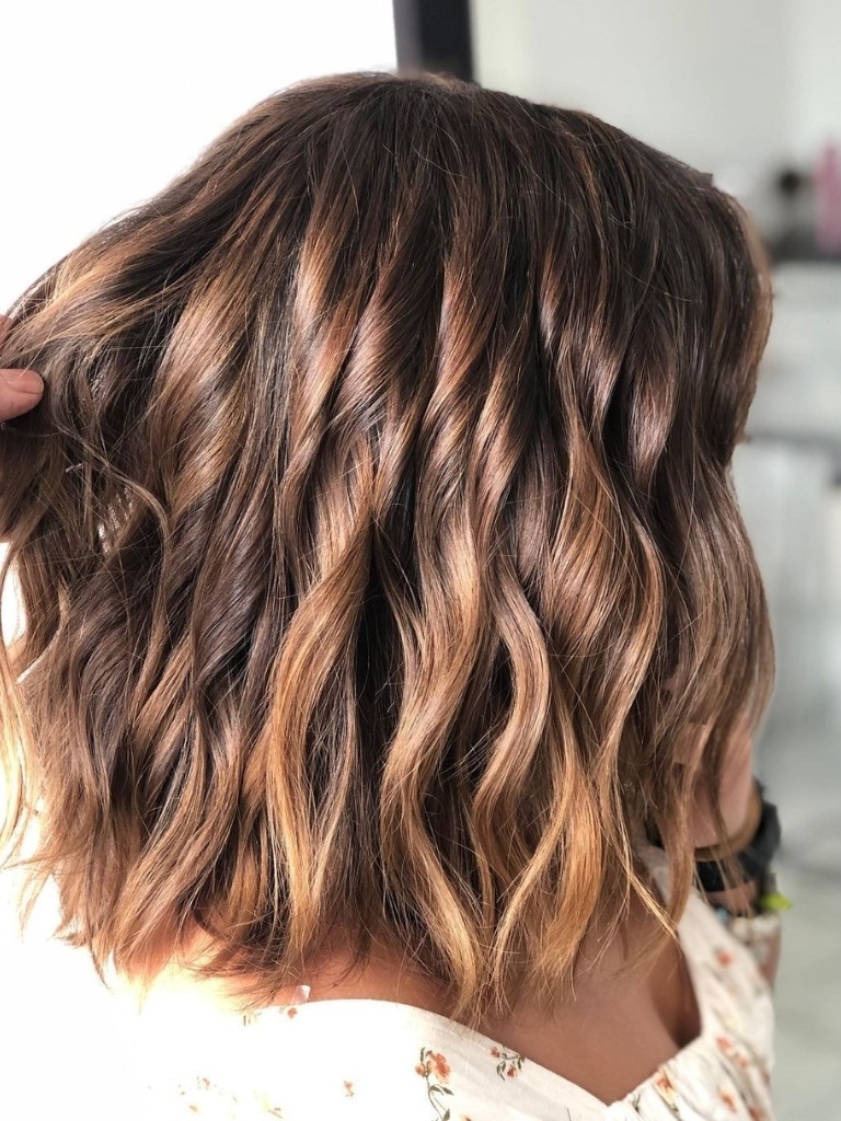Woman with medium length chestnut hair
