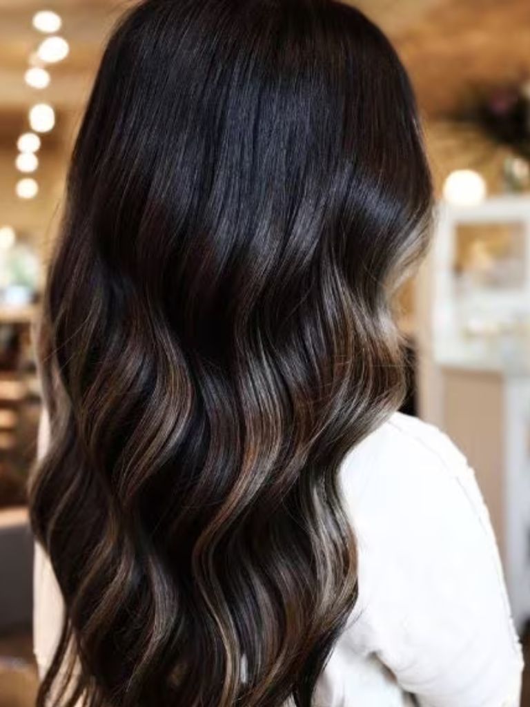 Woman with dark ash brown wavy hair
