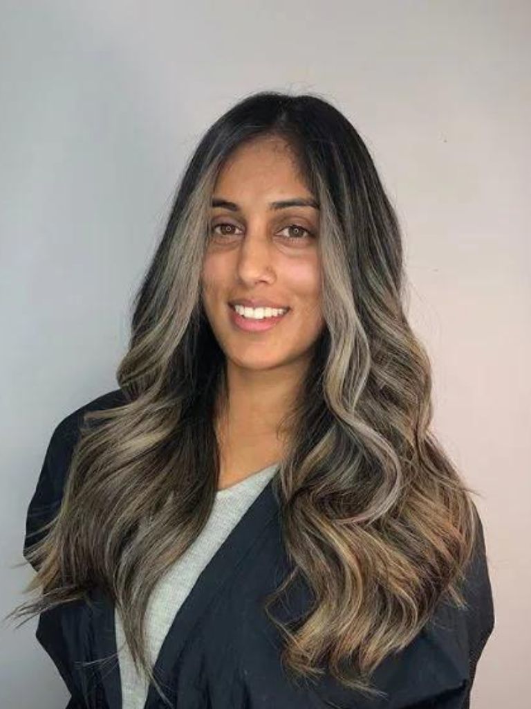 Woman with ash grey highlights on ash brown hair