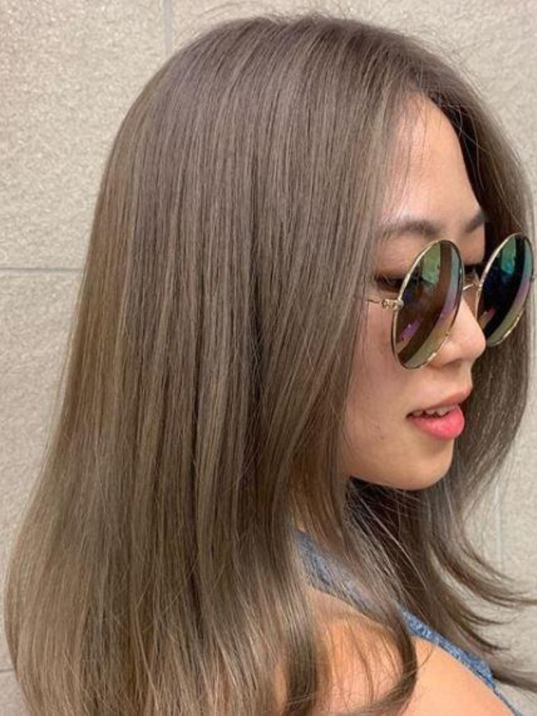 Woman with medium length ash brown hair