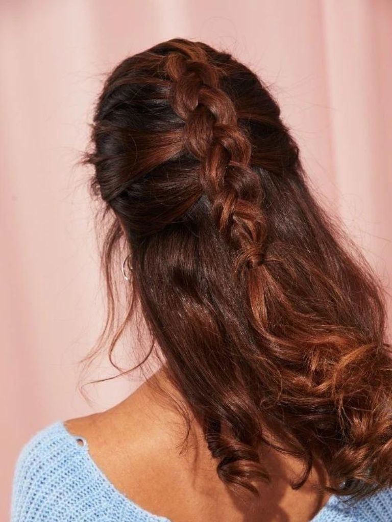 Woman wearing half-up Dutch Braid