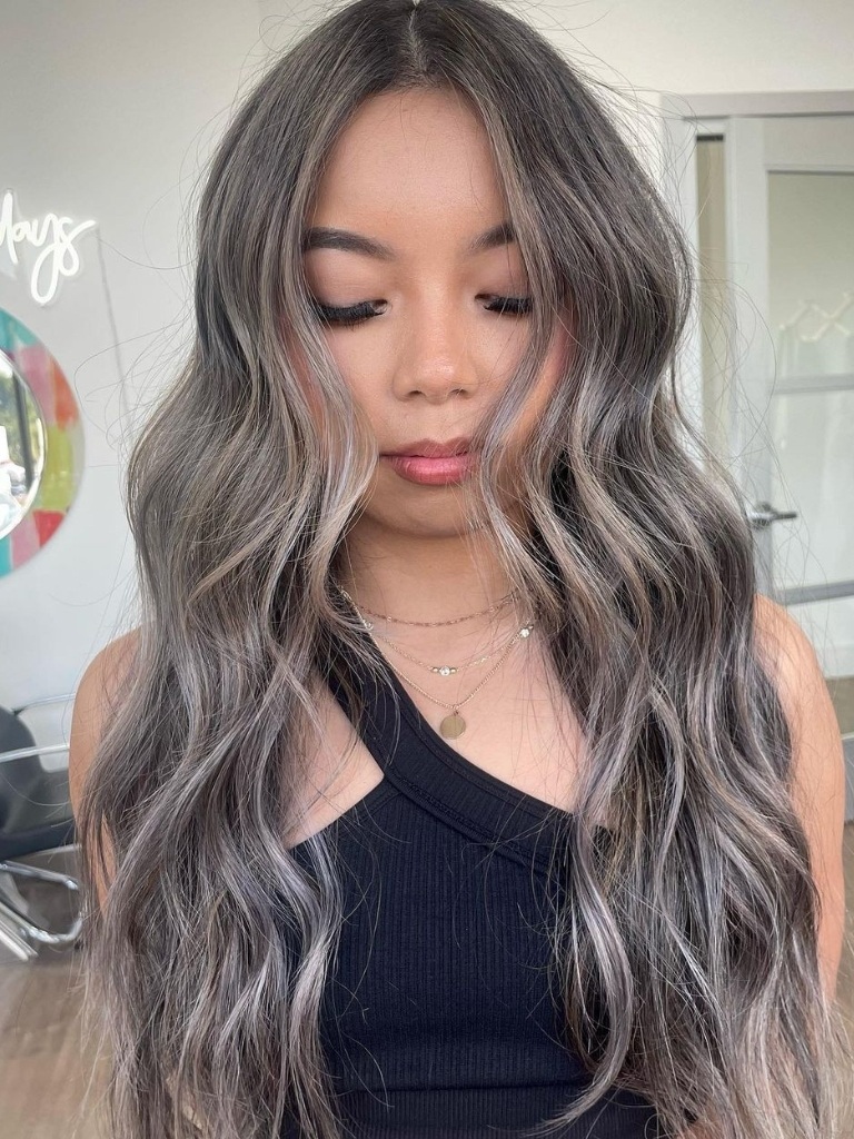 Woman with wavy metallic ashy hair
