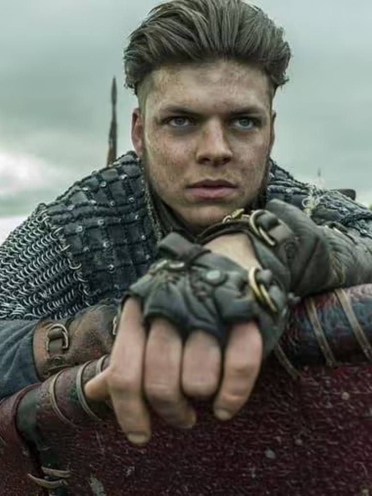 Viking hairstyles: Still of Vikings character with dark brown brushed back quiff with undercut on set