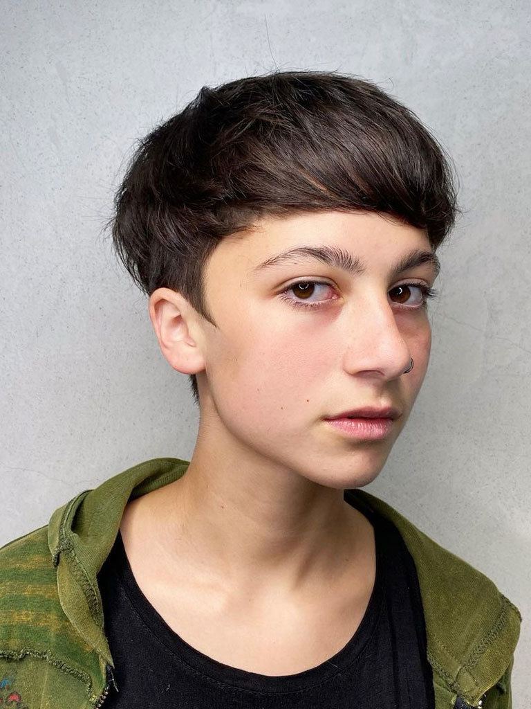 Woman with boy cut mushroom cut with elfin sideburns