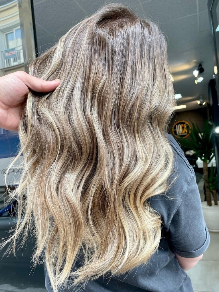 Person with wavy blonde hair