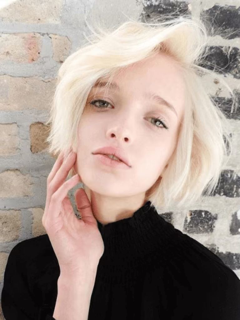 front facing view of a woman with short blonde hair