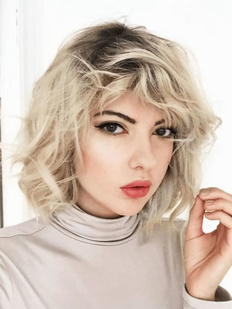 image of a woman with wavy blonde hair