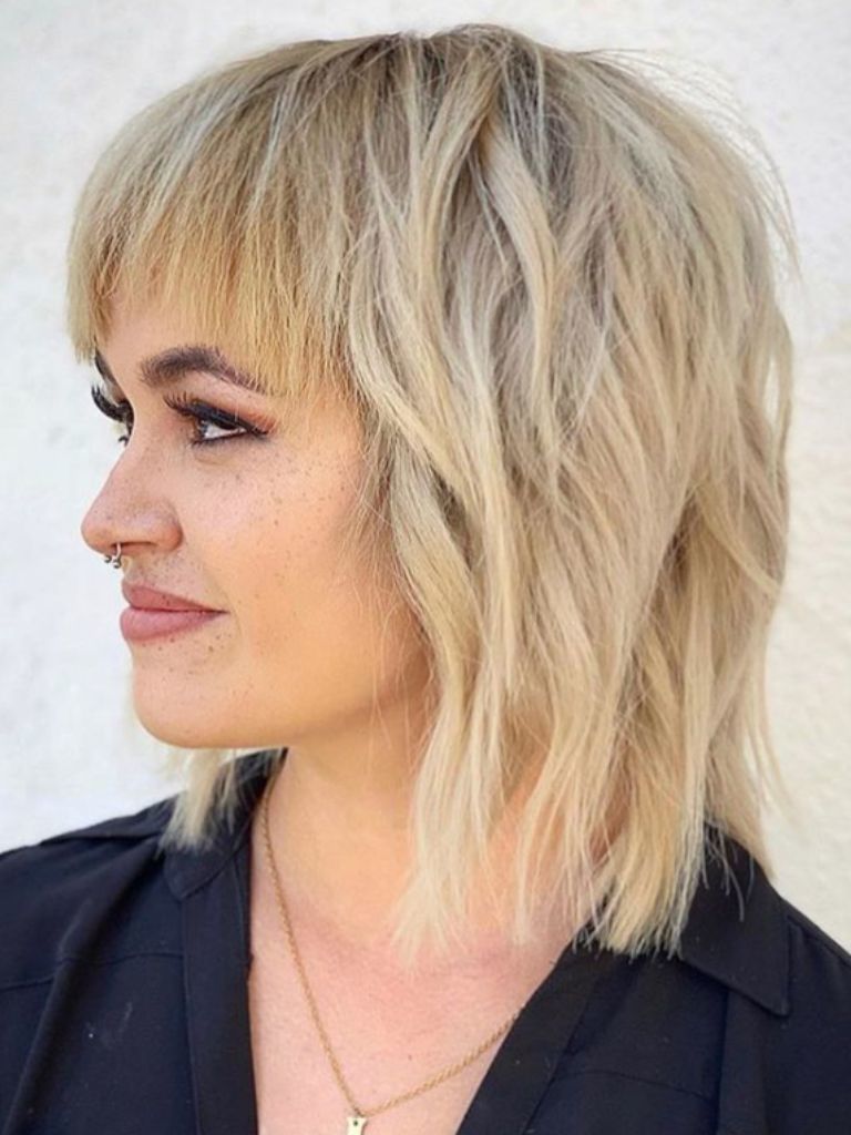 Blonde girl with shag bob hair cut
