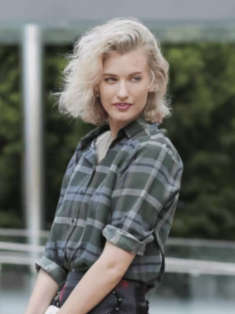 image of a woman with a blonde wavy bob
