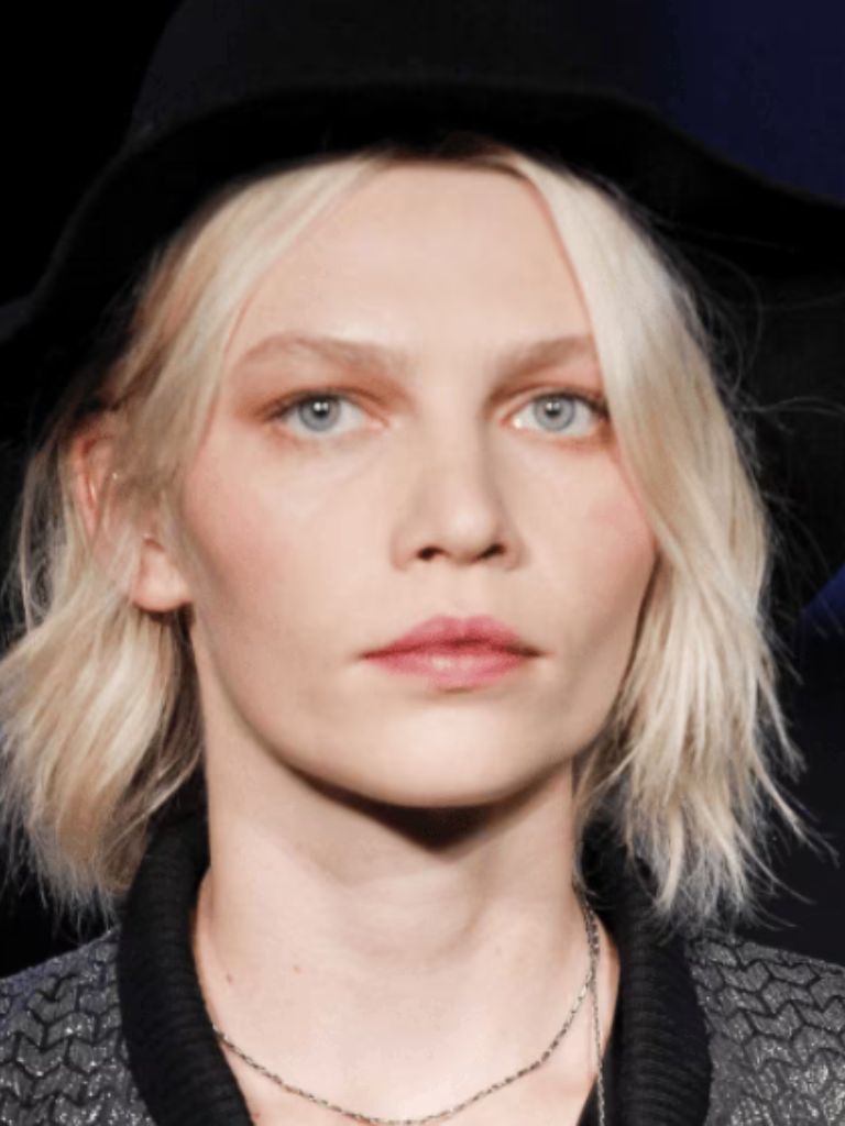 image of a woman wearing a hat with a blonde wavy bob