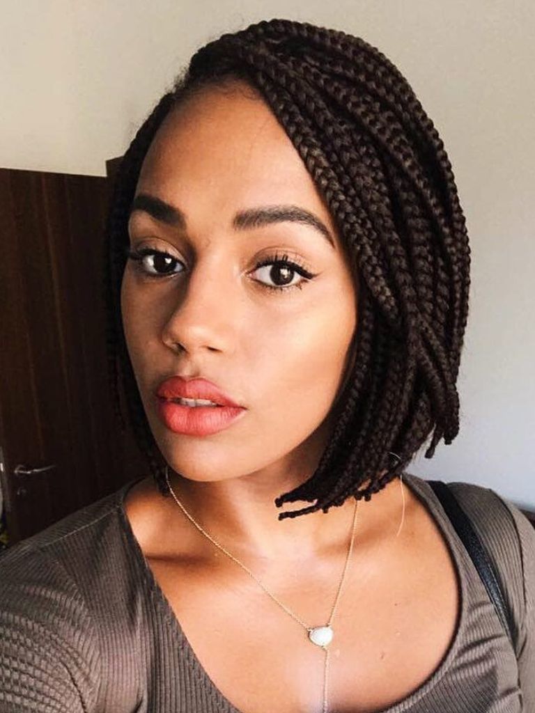 Woman with side swept short box braids hairstyle