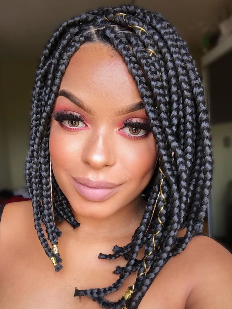 Woman with short braided asymmetrical bob with hair accessories