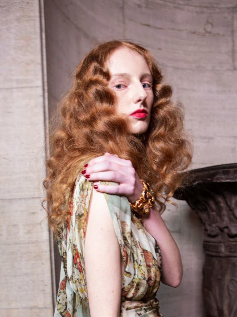 Woman with ginger crimped wavy hair