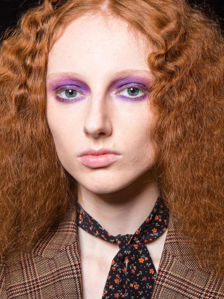 Woman with frizzy crimped ginger hair