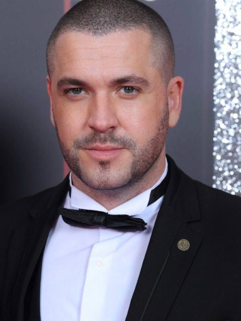 Hairstyles for receding hairline: Headshot of Shayne Ward with a buzz cut, wearing a tux