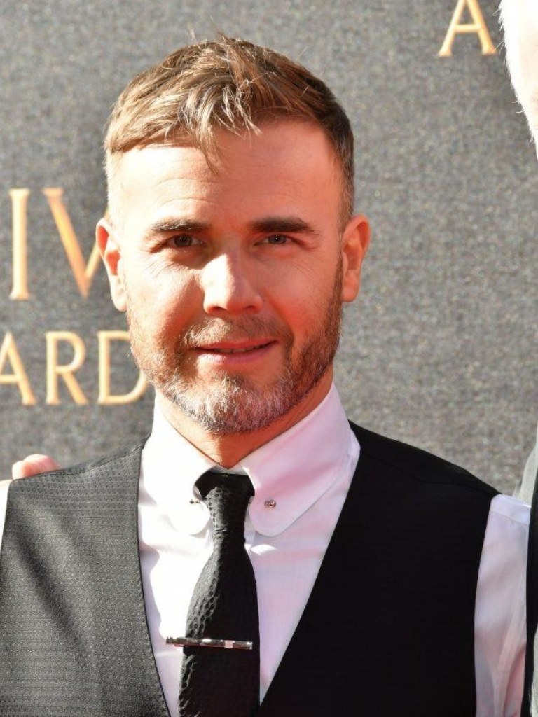 Gary Barlow with a French crop haircut with faded sides
