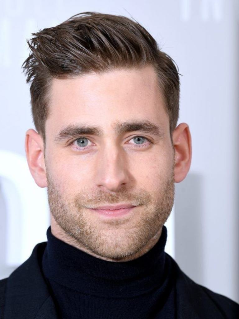 Oliver Jackson-Cohen with a side parted pompadour haircut