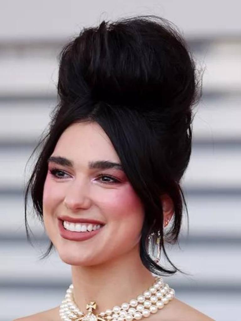 Dua Lipa with black beehive retro hairstyle.