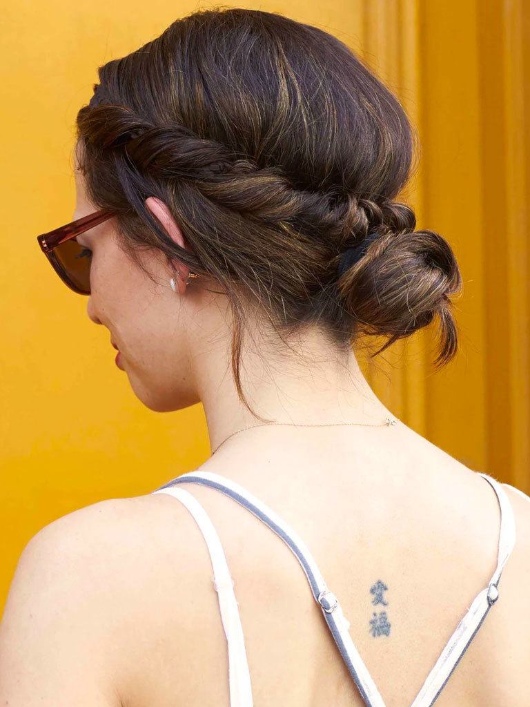 brunette woman with an elegant low twist hairstyle