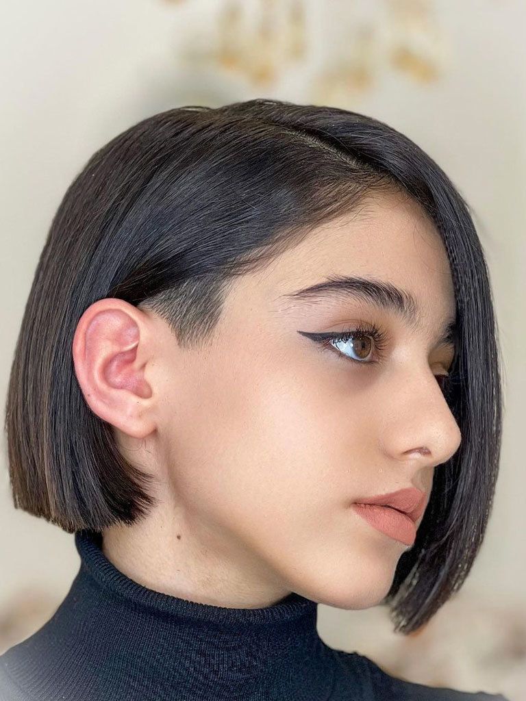 Woman with precision bob with shaved sideburns hairstyle