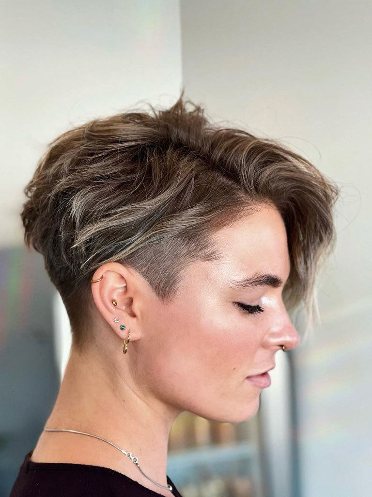 Woman with graduated mushroom cut with shaved sides and nape