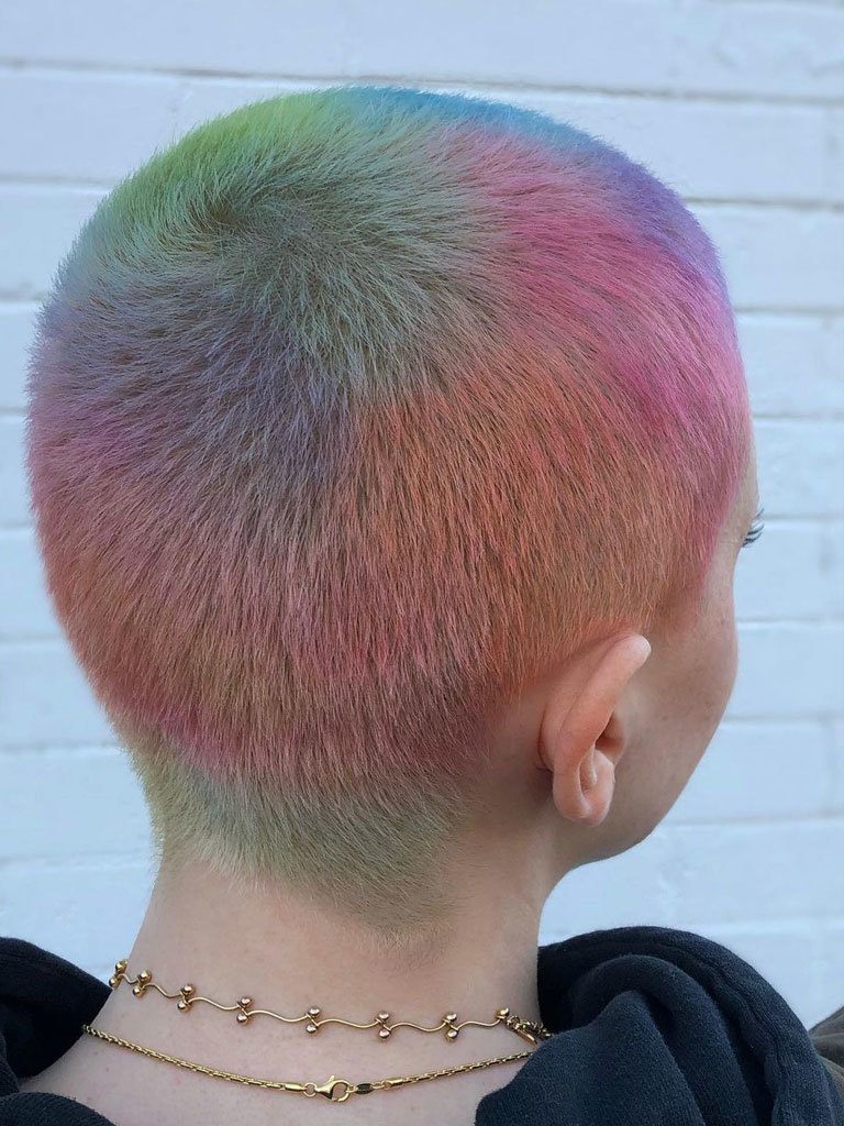 Woman with multicoloured buzzcut seen from the rear