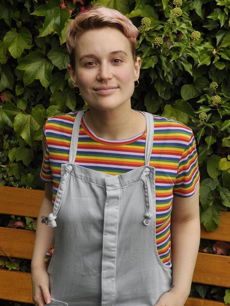 Woman with grown out buzzcut and shaved sides