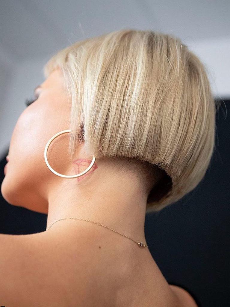 Woman seen from below with precision bob with hidden undercut