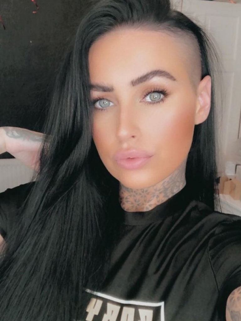 Woman with long black hair with shaved side on one side