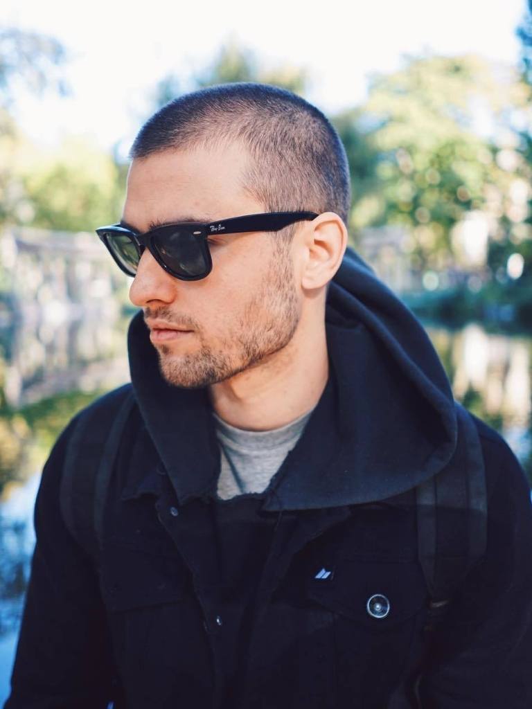 Man with a buzz cut and stubble