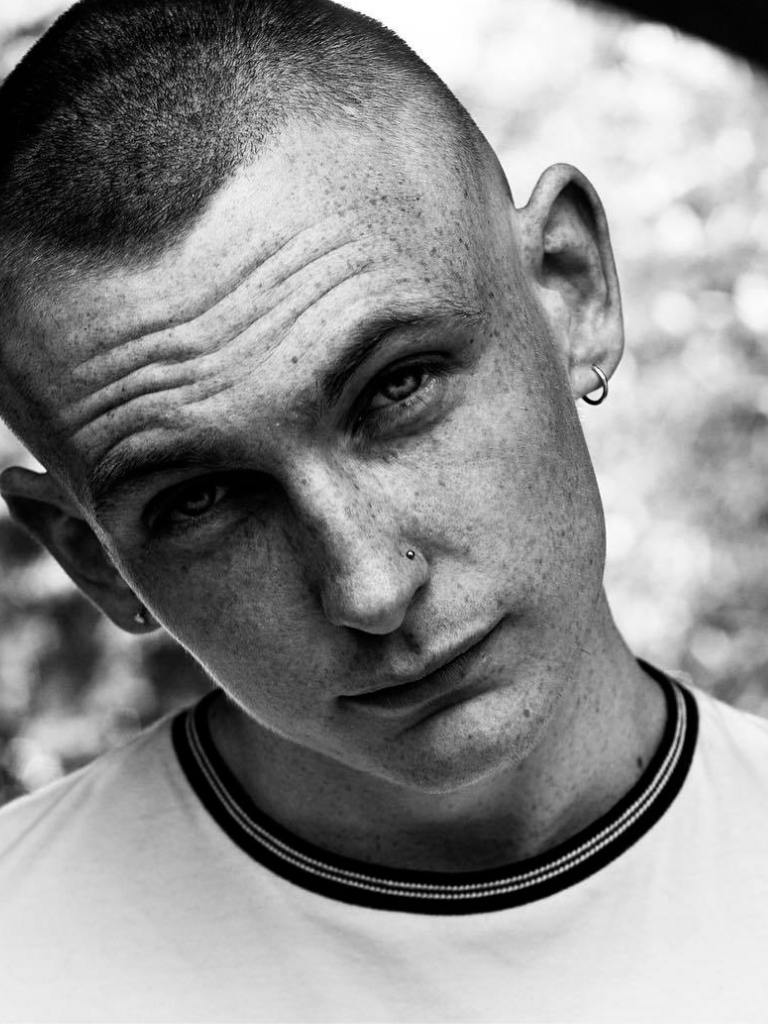 Man with a shaved buzz cut