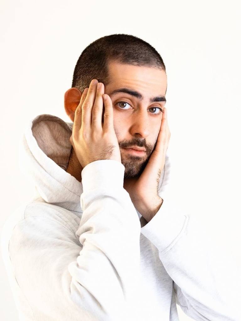 Man with a buzz cut with facial hair