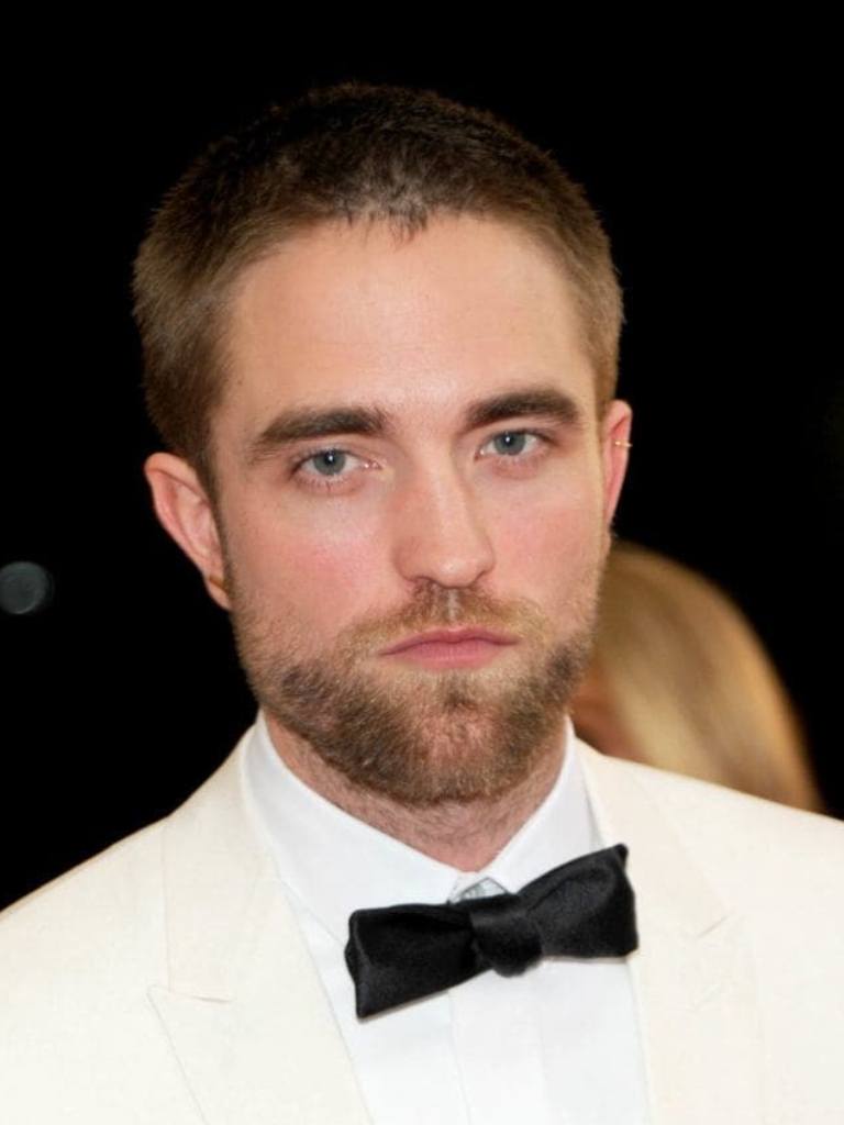 twilight star rob pattinson with a beard and long buzz cut