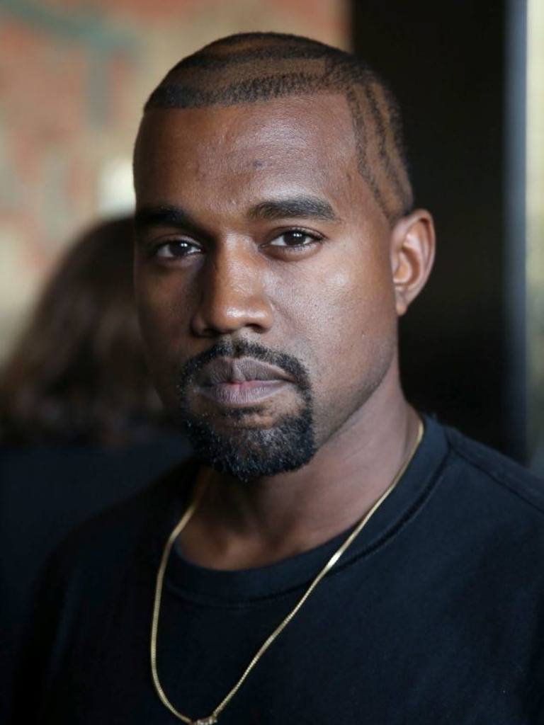 kanye west with a patterned buzz cut haircut