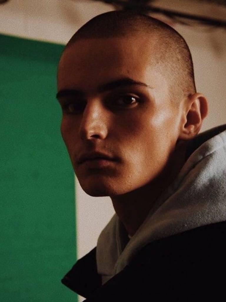 Man with a short shaved buzz cut